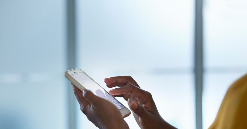Close-up of person's hands holding phone