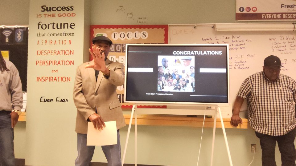 People presenting a powerpoint