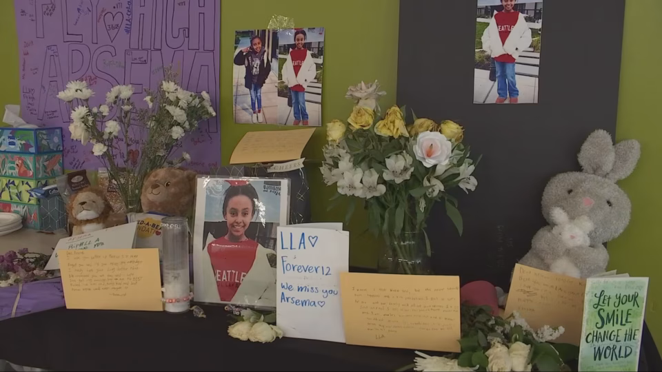 Cards and photos in honor of the 12-year-old student killed